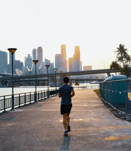 Home 33 Man jogging outdoors, supporting men's heart health through regular exercise