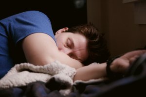 Home 33 Man sleeping peacefully, representing habits that support men's sleep health