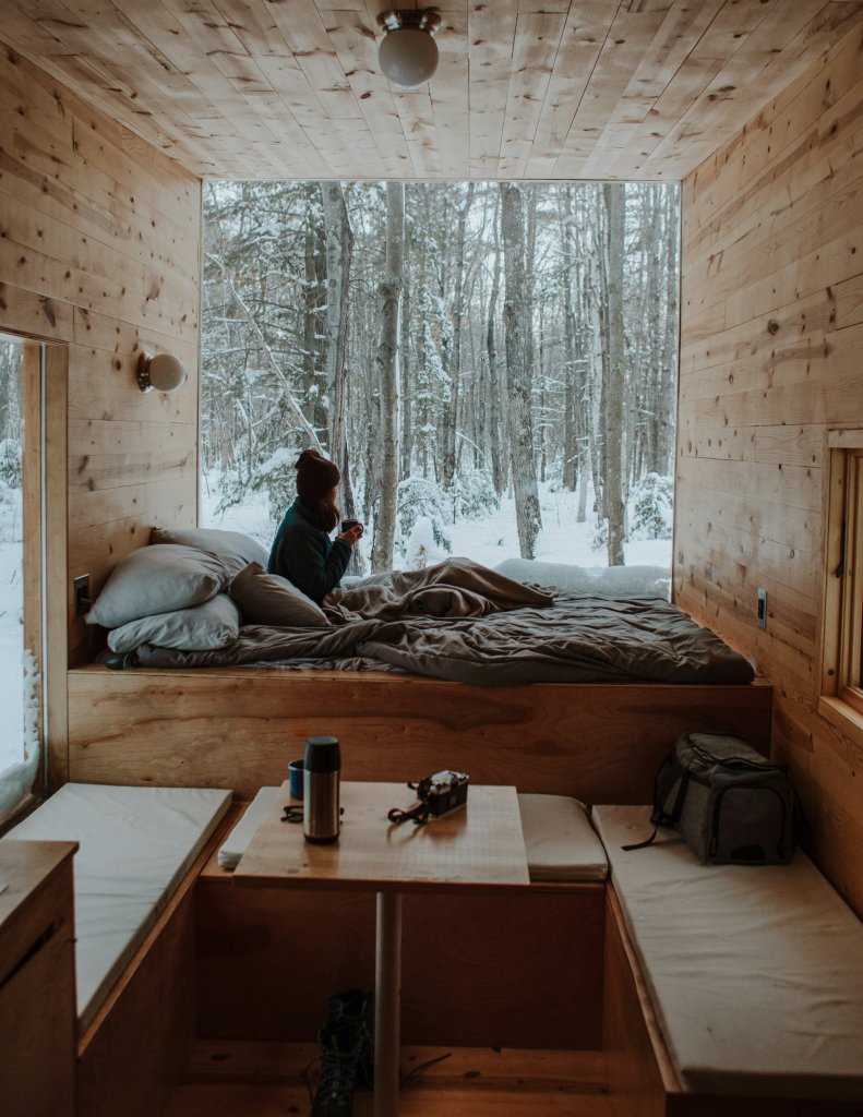 Seasonal Affective Disorder: Natural Ways to Feel Better 2 Woman sitting by a window in morning light, a natural habit that helps with seasonal affective disorder