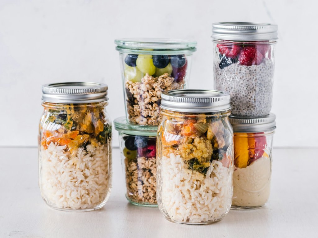 Glass jars of grains and legumes, food-first sources of iron for women